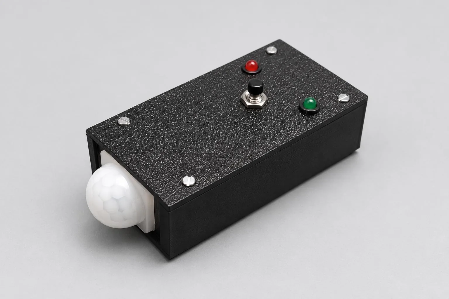Glaux, a small black unit with a motion sensor, a red and a green status light and a button